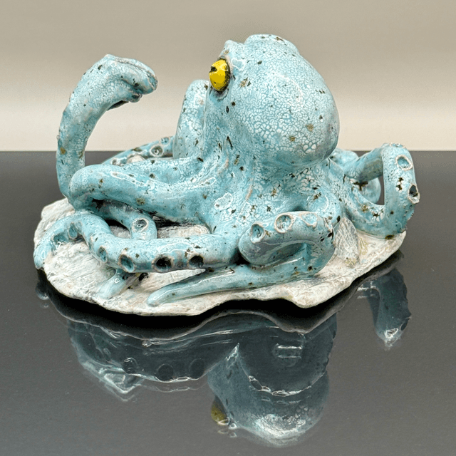 Italian hand gesture octopus on scallop shell