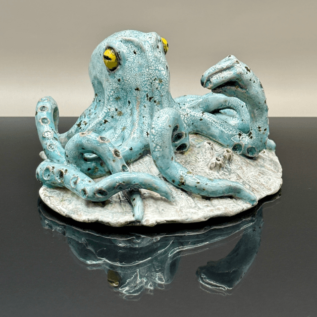 Italian hand gesture octopus on scallop shell