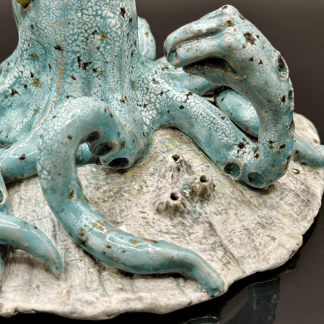 Italian hand gesture octopus on scallop shell