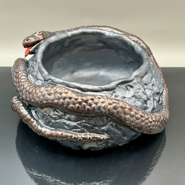 Snake crackpot with red lustre finish