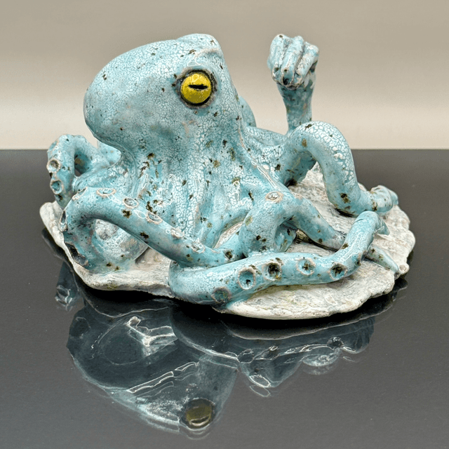 Italian hand gesture octopus on scallop shell