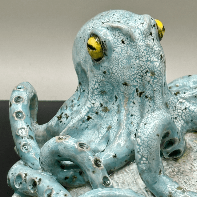 Italian hand gesture octopus on scallop shell